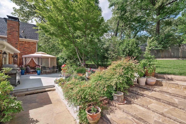 8792 E Carrollwood Ln E, Memphis, TN 38016 - view of yard with a gazebo, a patio, and fence