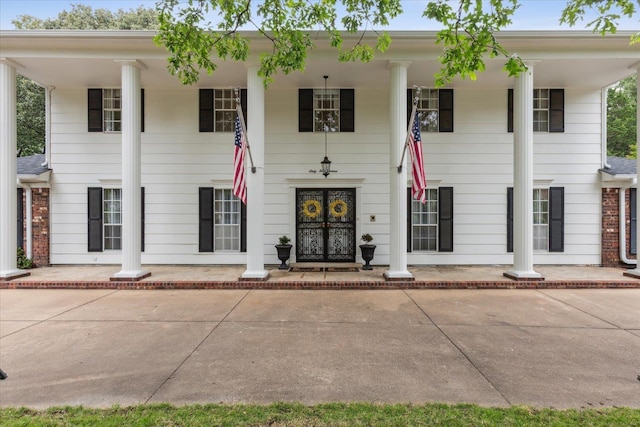 greek revival inspired property with a porch