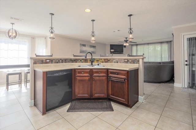 kitchen featuring dishwasher, a sink, ceiling fan, ornamental molding, and pendant lighting