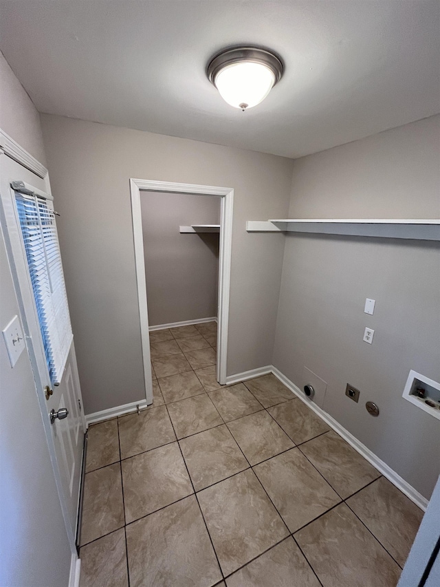 4810 Berrydale Ave, Memphis, TN 38118 - laundry room with hookup for an electric dryer, washer hookup, light tile patterned floors, and baseboards