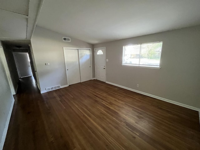 4810 Berrydale Ave, Memphis, TN 38118 - unfurnished bedroom with dark wood-style floors, lofted ceiling, baseboards, and a closet