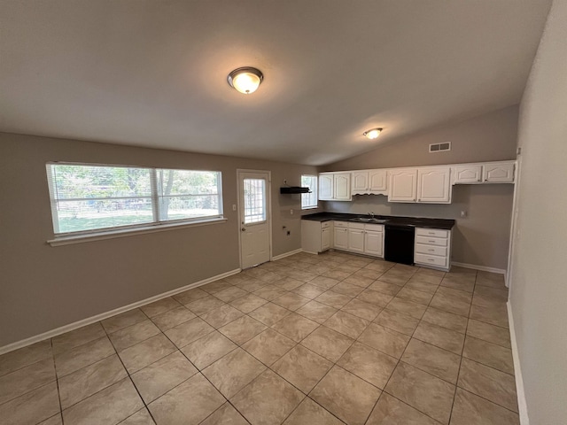 4810 Berrydale Ave, Memphis, TN 38118 - kitchen featuring dishwasher, a sink, dark countertops, white cabinetry, and light tile patterned floors