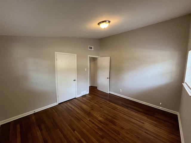 4810 Berrydale Ave, Memphis, TN 38118 - unfurnished bedroom featuring dark wood-style floors and baseboards
