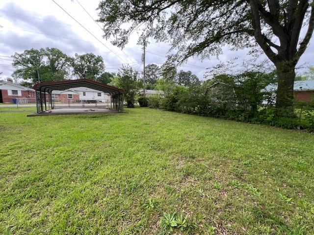 view of yard featuring a carport