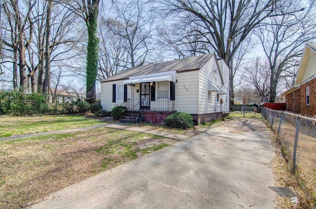 bungalow-style home featuring driveway and a shingled roof
