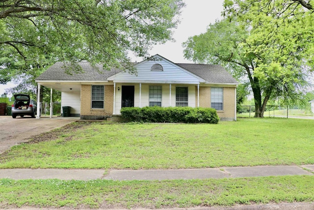 7206 N Juana Dr, Millington, TN 38053 - single story home with brick siding, concrete driveway, an attached carport, and roof with shingles
