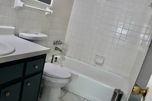 7206 N Juana Dr, Millington, TN 38053 - full bathroom featuring toilet, vanity, tile walls, and bathing tub / shower combination