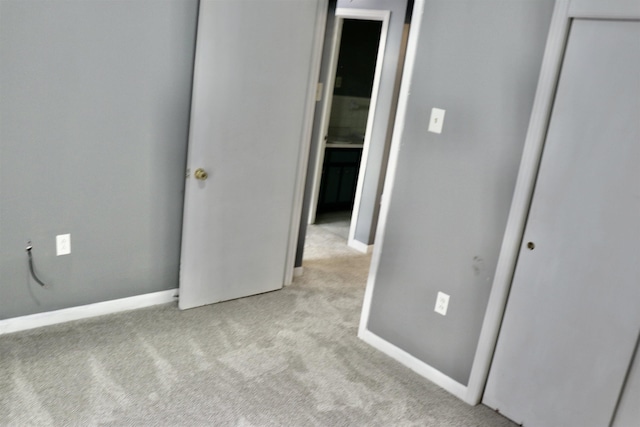 7206 N Juana Dr, Millington, TN 38053 - unfurnished bedroom with light colored carpet, a closet, and baseboards