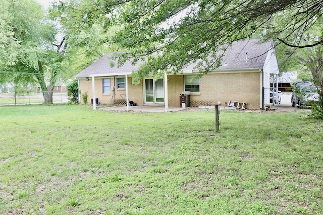 7206 N Juana Dr, Millington, TN 38053 - rear view of house featuring a patio, brick siding, and roof with shingles