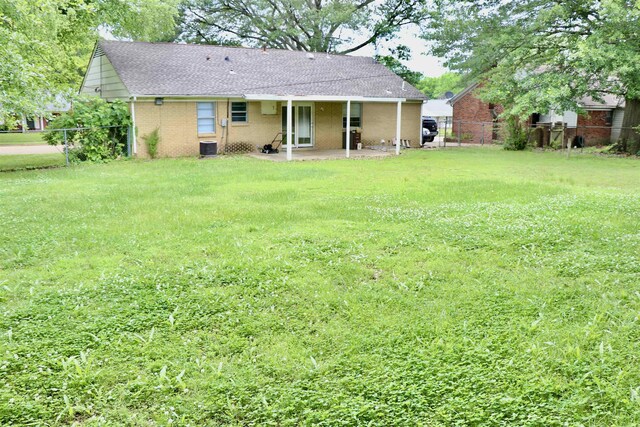 7206 N Juana Dr, Millington, TN 38053 - rear view of house with brick siding, a patio, and a shingled roof