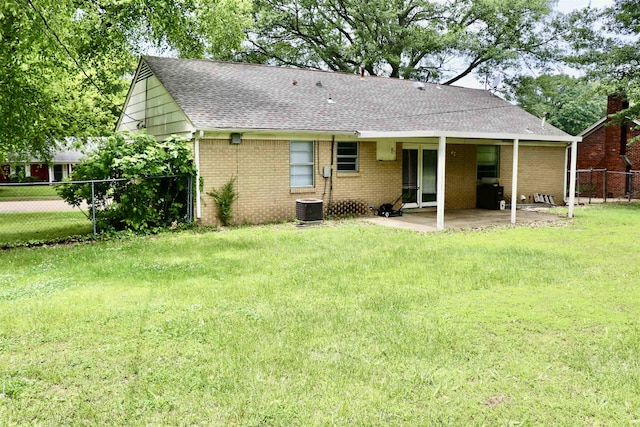 7206 N Juana Dr, Millington, TN 38053 - rear view of property with roof with shingles, a patio area, brick siding, and cooling unit