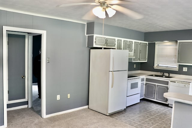 7206 N Juana Dr, Millington, TN 38053 - kitchen with white appliances, a sink, light countertops, a ceiling fan, and baseboards