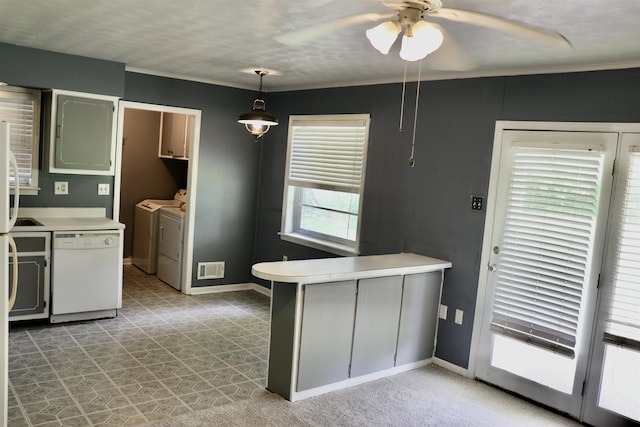 7206 N Juana Dr, Millington, TN 38053 - kitchen featuring dishwasher, washing machine and clothes dryer, a peninsula, a ceiling fan, and baseboards
