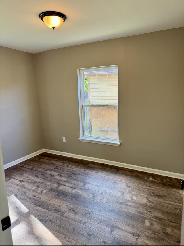 852 Marianna St, Memphis, TN 38114 - unfurnished room featuring dark wood-style flooring and baseboards