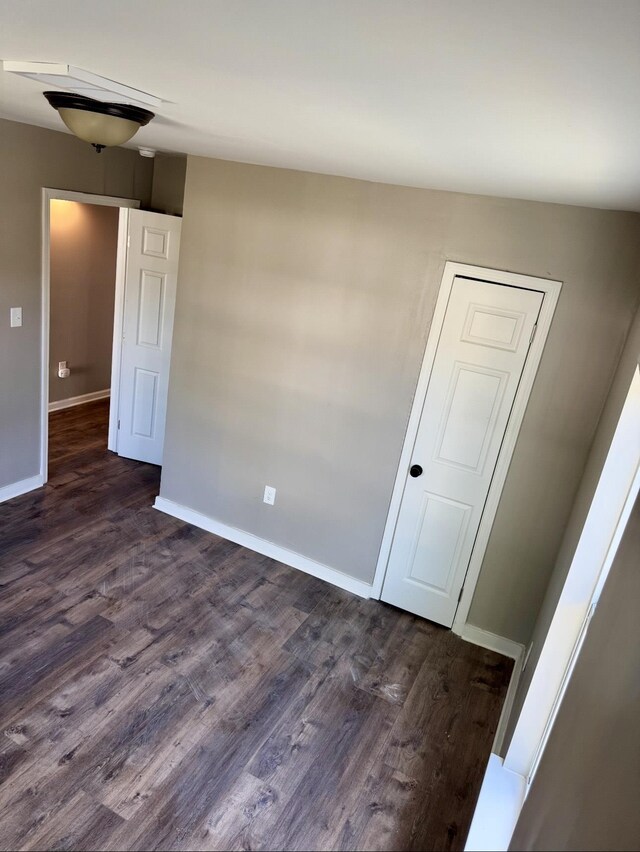 852 Marianna St, Memphis, TN 38114 - unfurnished room with dark wood-style floors and baseboards