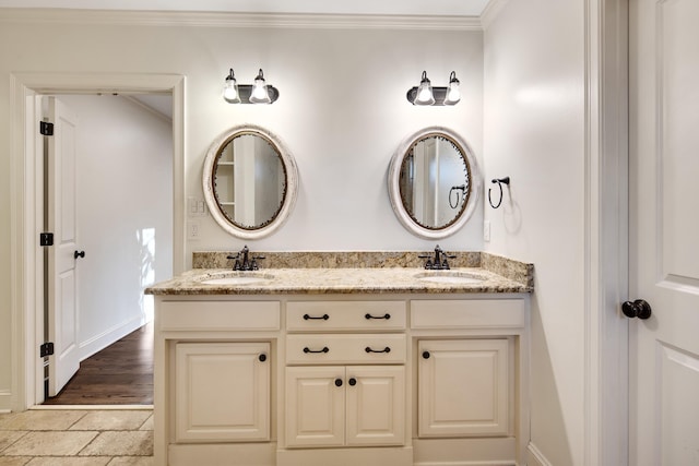 3850 Poplar Ave, Memphis, TN 38111 - bathroom with crown molding, stone tile floors, double vanity, and baseboards