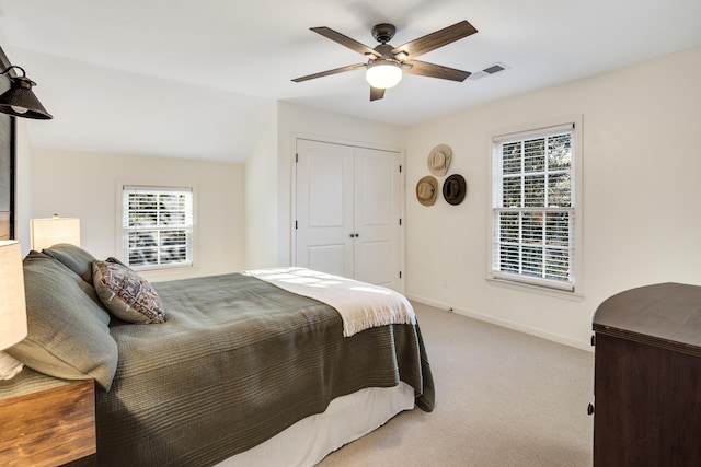 3850 Poplar Ave, Memphis, TN 38111 - bedroom with light carpet, baseboards, ceiling fan, and a closet