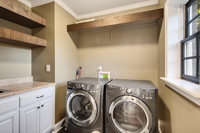 3850 Poplar Ave, Memphis, TN 38111 - clothes washing area featuring separate washer and dryer, ornamental molding, cabinet space, and baseboards
