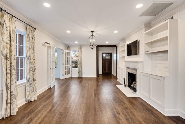 3850 Poplar Ave, Memphis, TN 38111 - unfurnished living room featuring dark wood-type flooring, baseboards, recessed lighting, a chandelier, and ornamental molding