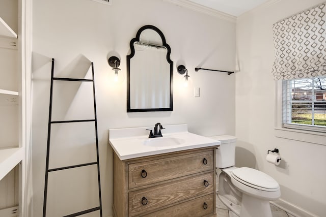 3850 Poplar Ave, Memphis, TN 38111 - bathroom with toilet, vanity, ornamental molding, and baseboards