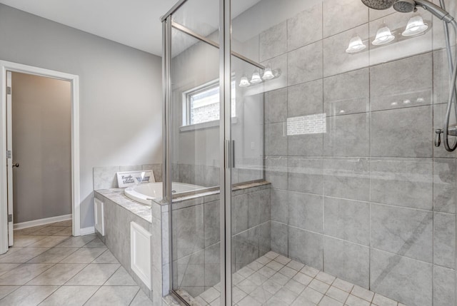 135 Briar Hollow Ln, Oakland, TN 38060 - bathroom featuring a stall shower, a bath, and tile patterned floors