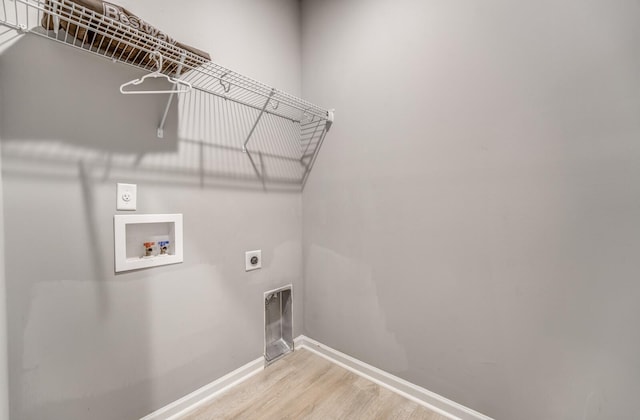 135 Briar Hollow Ln, Oakland, TN 38060 - clothes washing area featuring electric dryer hookup, hookup for a washing machine, baseboards, and wood finished floors