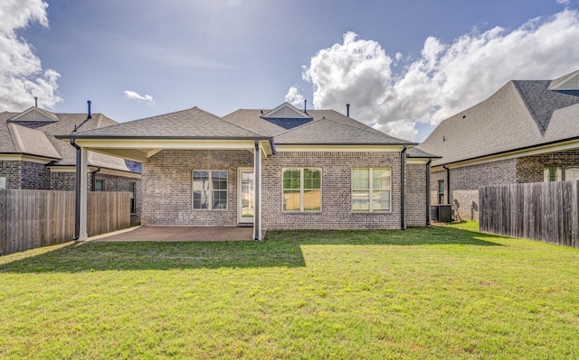 135 Briar Hollow Ln, Oakland, TN 38060 - back of property with a patio area, central AC unit, brick siding, and a shingled roof