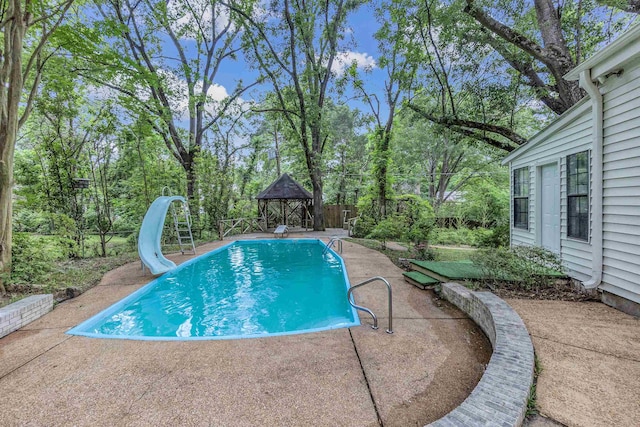 1793 Hayden Rd, Germantown, TN 38138 - outdoor pool featuring a gazebo, a water slide, a patio area, view of wooded area, and a fenced backyard
