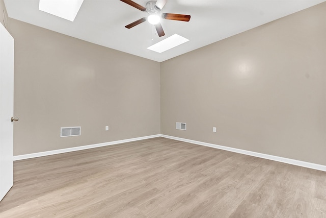 1793 Hayden Rd, Germantown, TN 38138 - empty room featuring a skylight, ceiling fan, vaulted ceiling, light wood-type flooring, and baseboards
