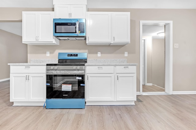 1793 Hayden Rd, Germantown, TN 38138 - kitchen with stainless steel range with electric stovetop, light wood-style flooring, and white cabinets