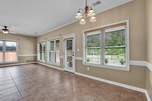 unfurnished dining area featuring ceiling fan, a chandelier, tile patterned floors, crown molding, and baseboards