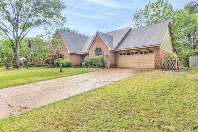 traditional home featuring brick siding, a garage, and concrete driveway