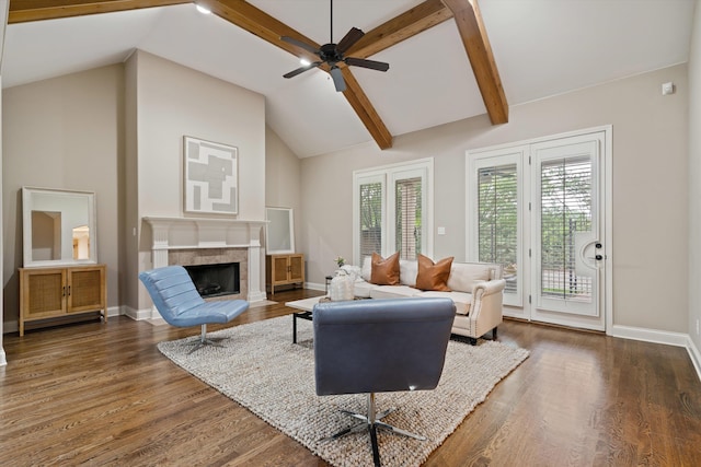 984 Russell Farms Rd, Collierville, TN 38017 - living area featuring a tiled fireplace, a ceiling fan, dark wood-type flooring, and baseboards