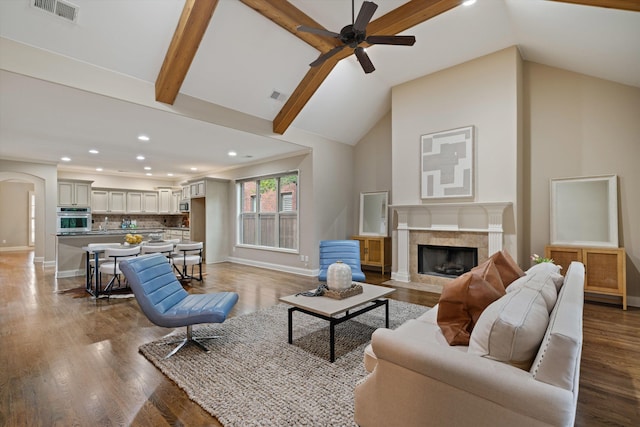 984 Russell Farms Rd, Collierville, TN 38017 - living room featuring recessed lighting, ceiling fan, a tiled fireplace, baseboards, and wood finished floors