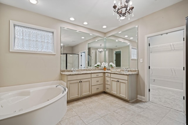 984 Russell Farms Rd, Collierville, TN 38017 - full bathroom featuring a chandelier, a shower stall, tile patterned flooring, recessed lighting, and a whirlpool tub