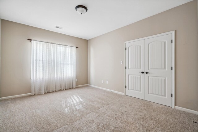 984 Russell Farms Rd, Collierville, TN 38017 - unfurnished bedroom with carpet, a closet, and baseboards