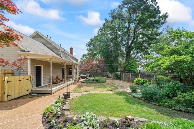 view of yard with a wooden deck