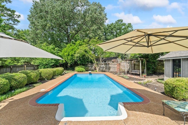 view of swimming pool featuring a fenced backyard