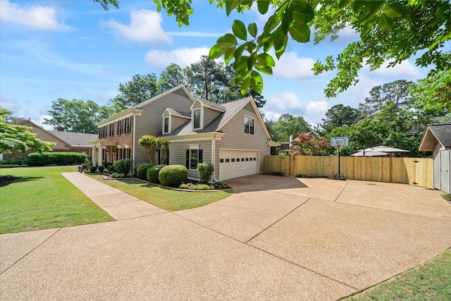 view of front of house featuring concrete driveway and an attached garage
