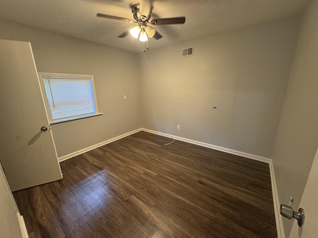 3602 Gowan Dr, Memphis, TN 38127 - spare room featuring ceiling fan, dark wood-style floors, baseboards, and a textured ceiling