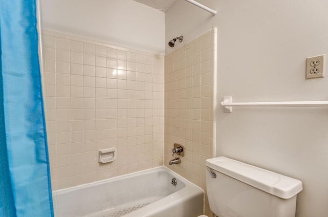 bathroom with shower / tub combo and toilet