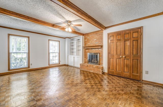 unfurnished living room with a textured ceiling, ceiling fan, baseboards, a brick fireplace, and built in features