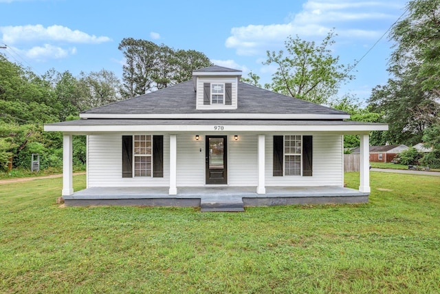 view of front of home featuring covered porch and a front yard