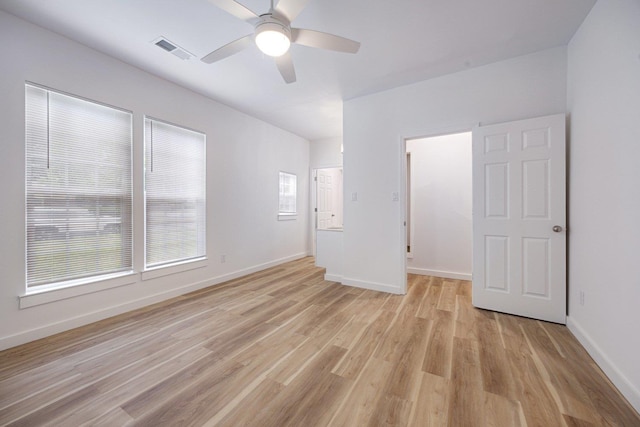 unfurnished bedroom featuring light wood-style flooring and baseboards