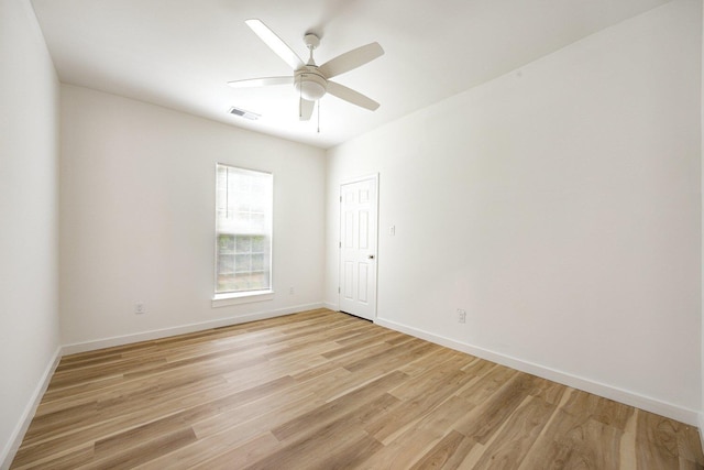 unfurnished room with light wood-type flooring, baseboards, and ceiling fan