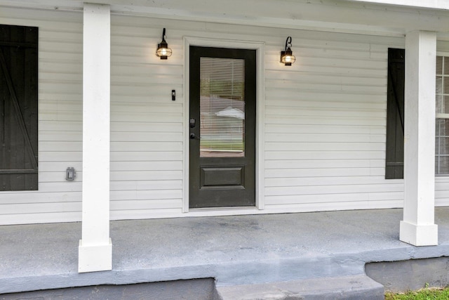 entrance to property with covered porch