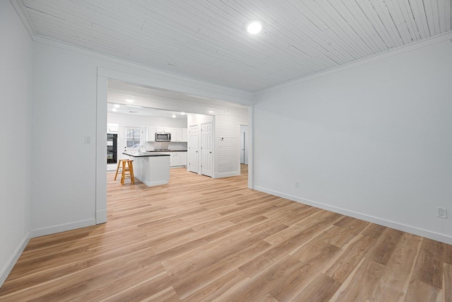 unfurnished living room with crown molding, light wood-style flooring, baseboards, wood ceiling, and recessed lighting