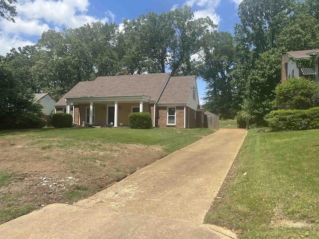 3236 Whitney Rd, Memphis, TN 38128 - view of front of home with a front yard, concrete driveway, brick siding, and covered porch