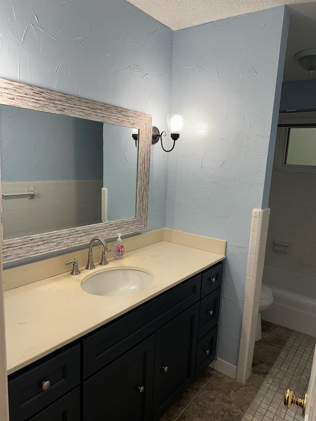 3236 Whitney Rd, Memphis, TN 38128 - bathroom with vanity, toilet, tile patterned floors, and a textured ceiling