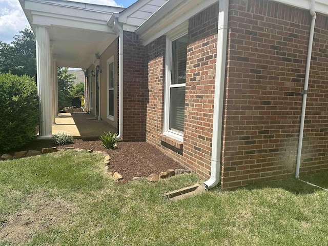 3236 Whitney Rd, Memphis, TN 38128 - view of side of property with brick siding and a lawn